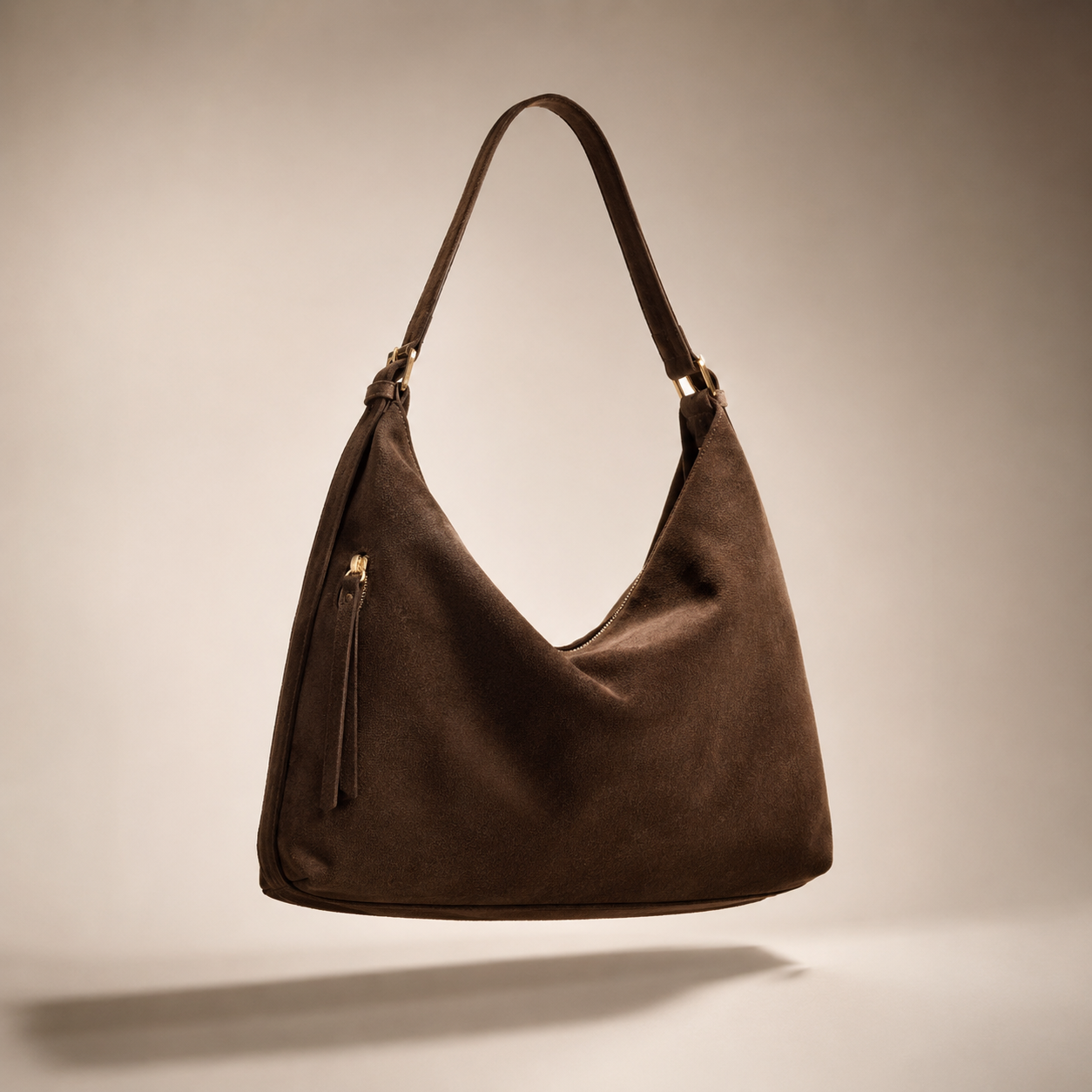 Brown suede hobo bag studio shot